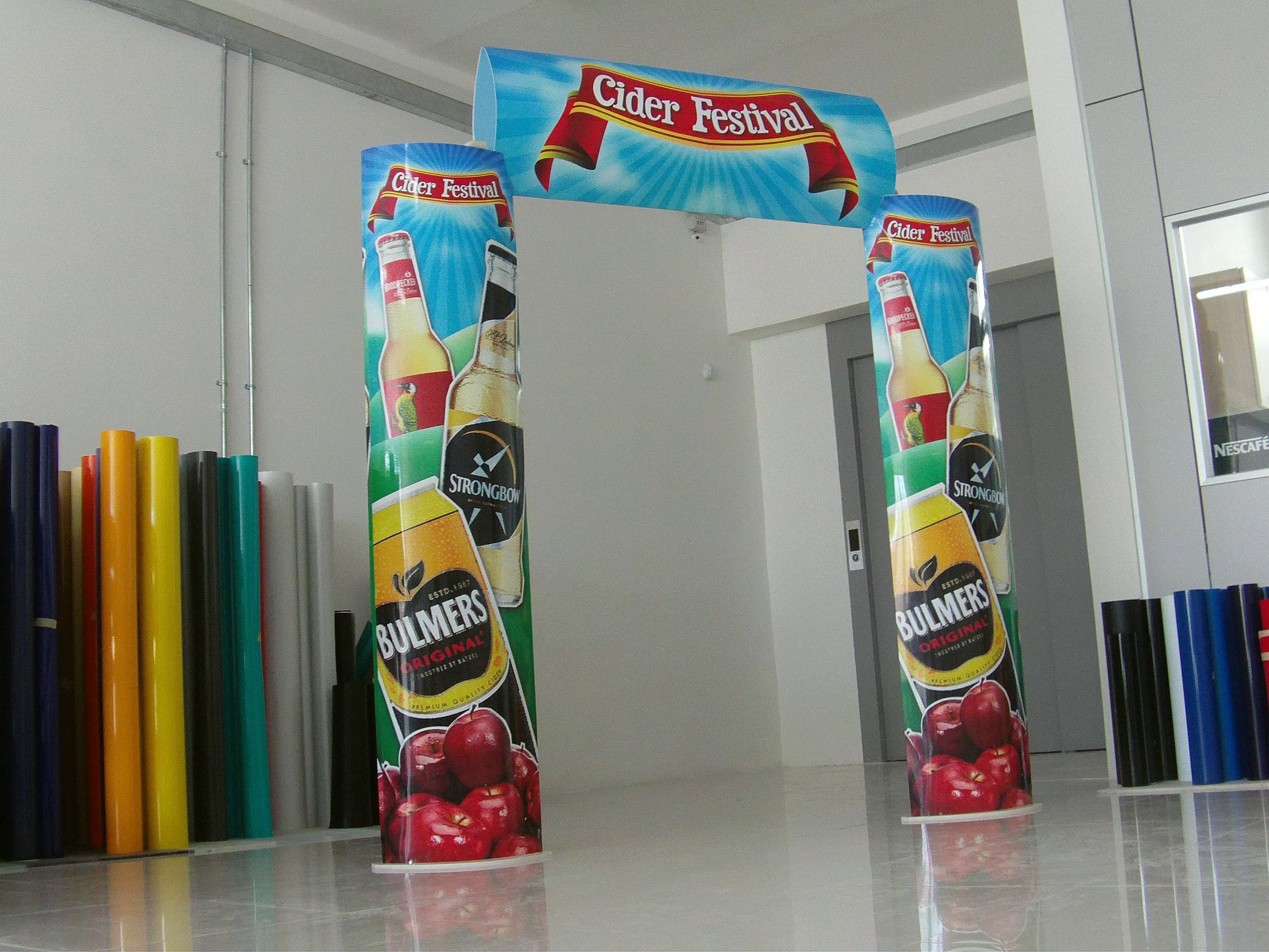 Printed event entrance archway with two matching columns standing inside a production studio