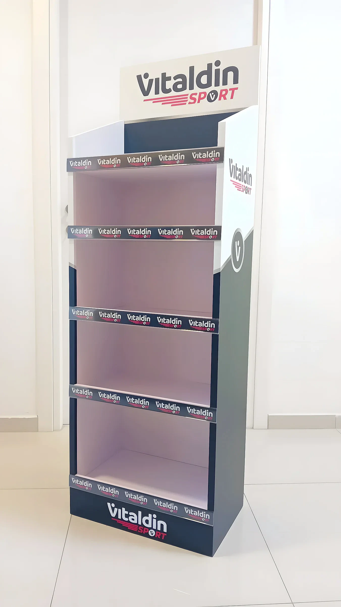 Black and white four-shelf retail display unit with a branded header and printed shelf strips