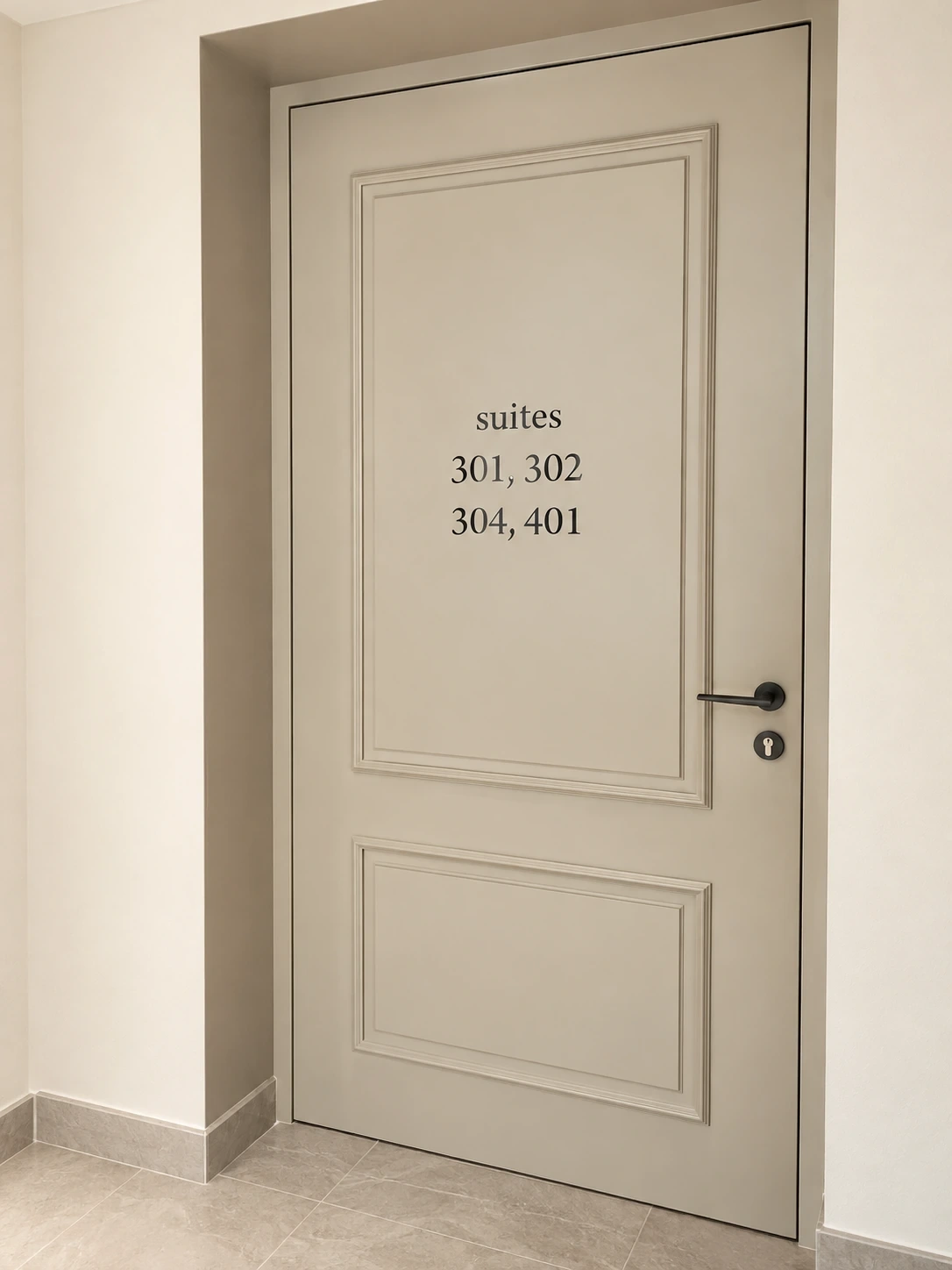 Cut vinyl suite numbers applied to a panelled cream door