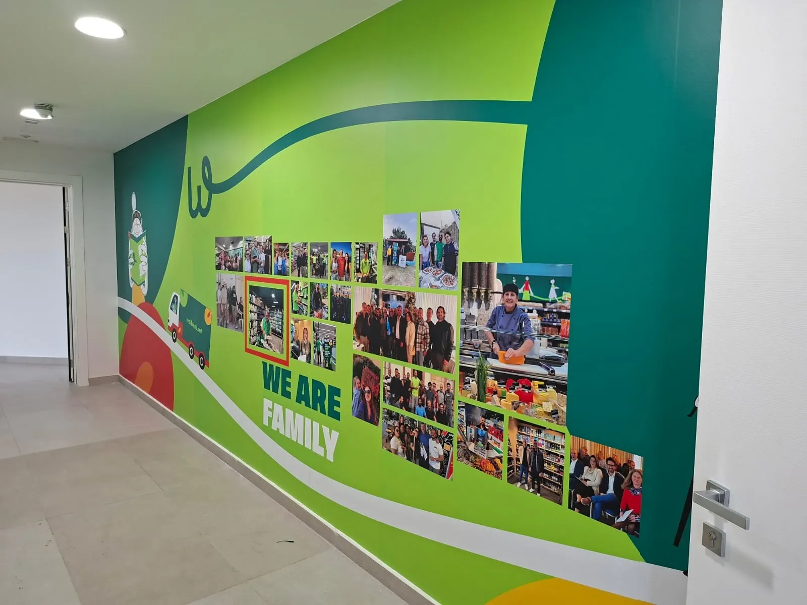 Green corridor wall graphic combining flowing brand shapes with a printed photo collage