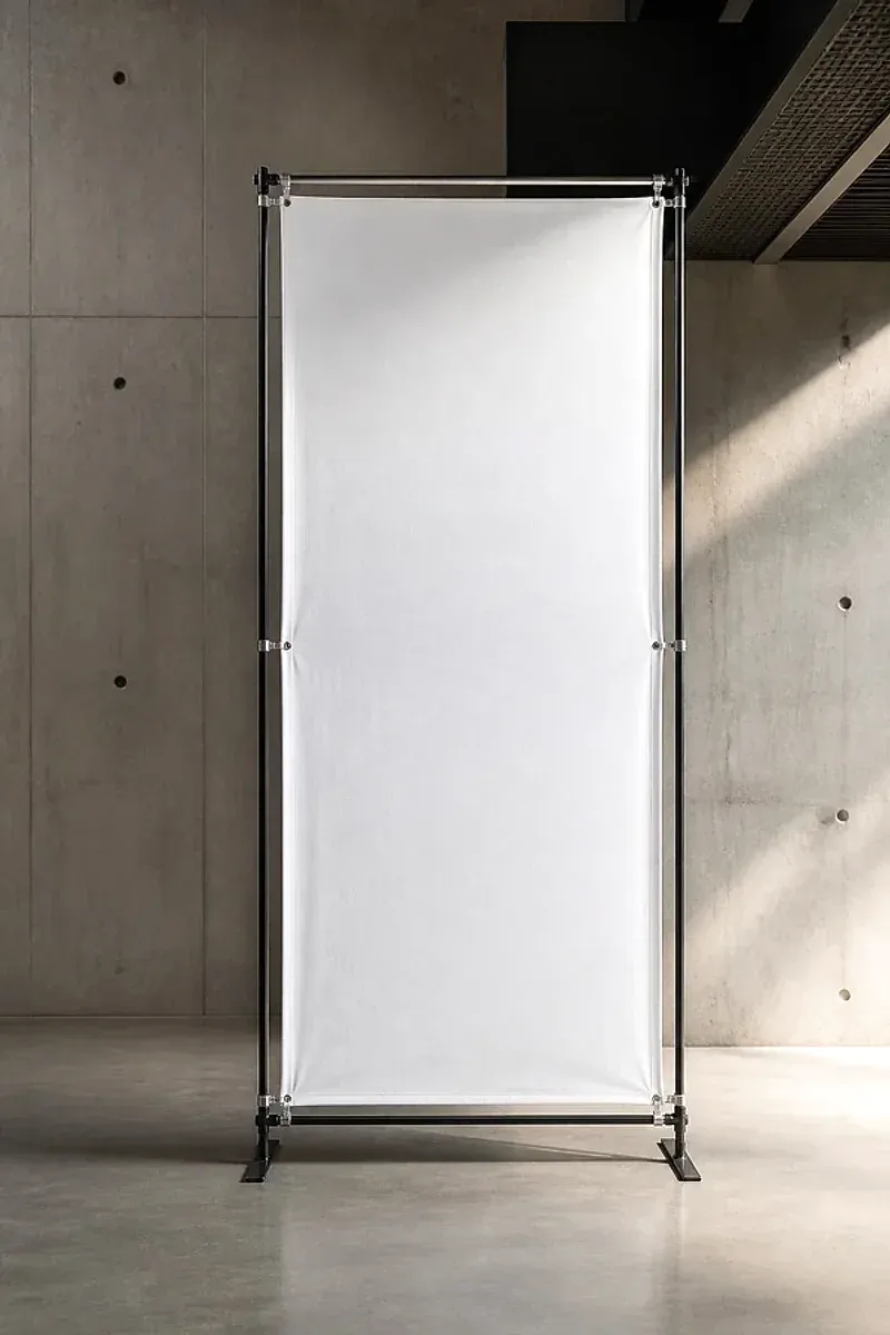 A printed banner held taut in a free-standing tension frame.