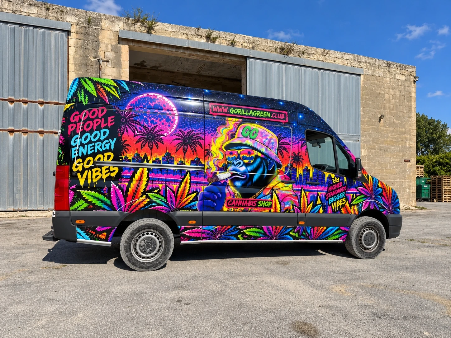 High-roof van wrapped in a vivid airbrush-style design with neon palms, a cartoon gorilla and bold slogans, parked outside a stone warehouse