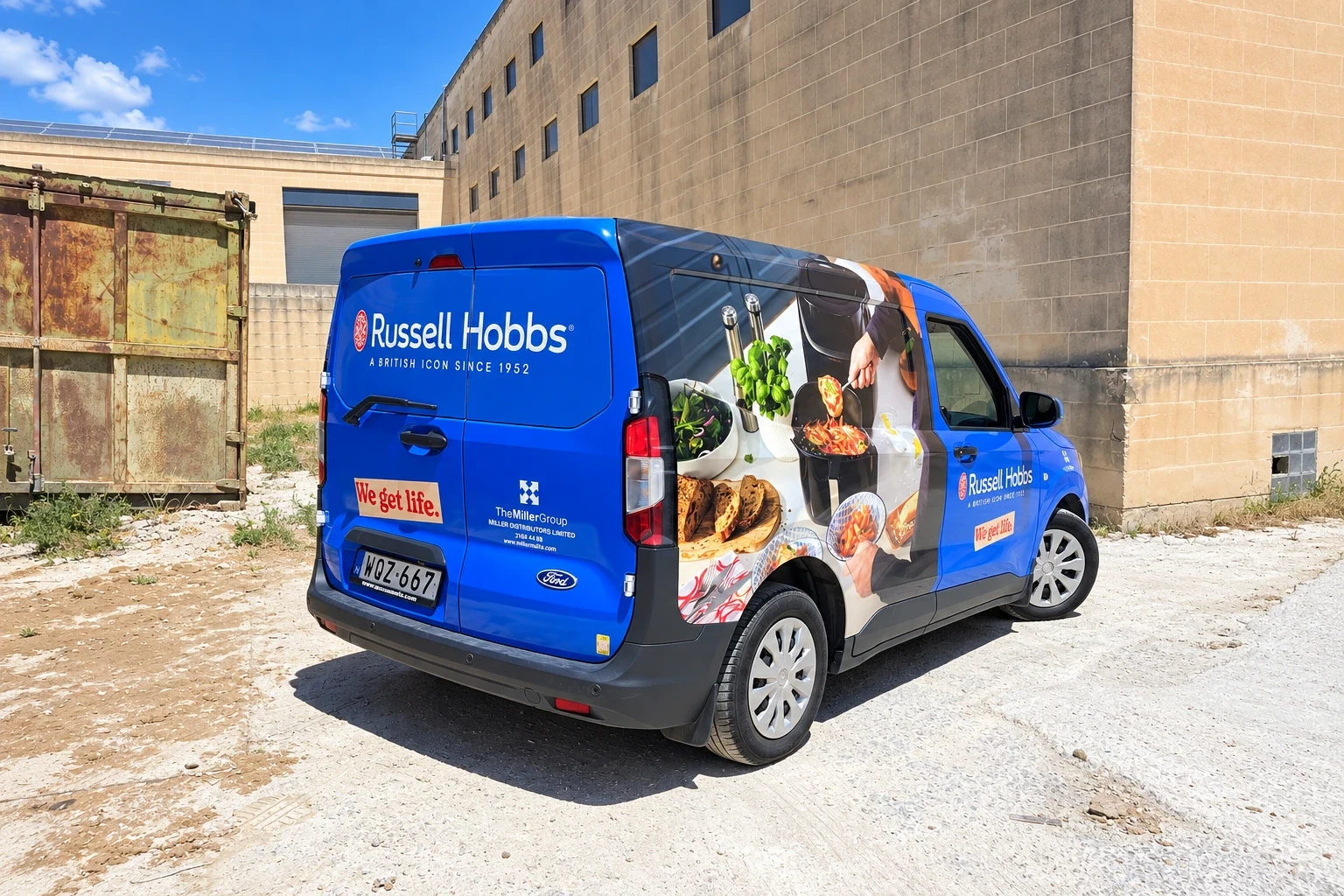 Blue compact van wrapped with kitchen and food photography along its side panel