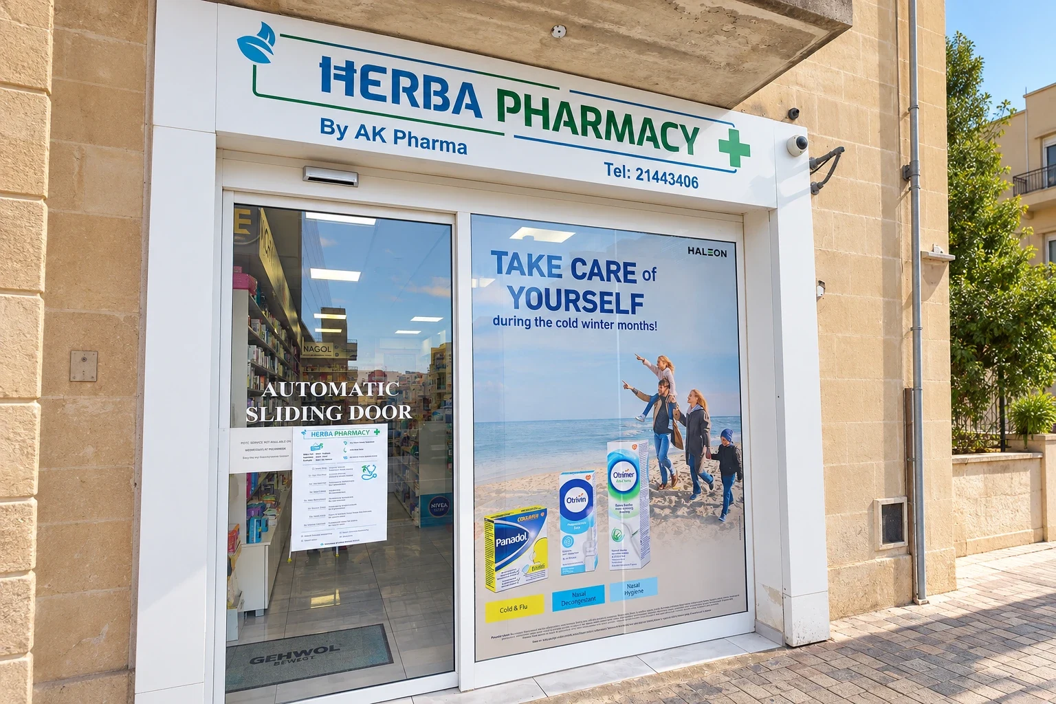 Printed one-way vision window panel showing a seasonal health campaign beside a pharmacy fascia sign